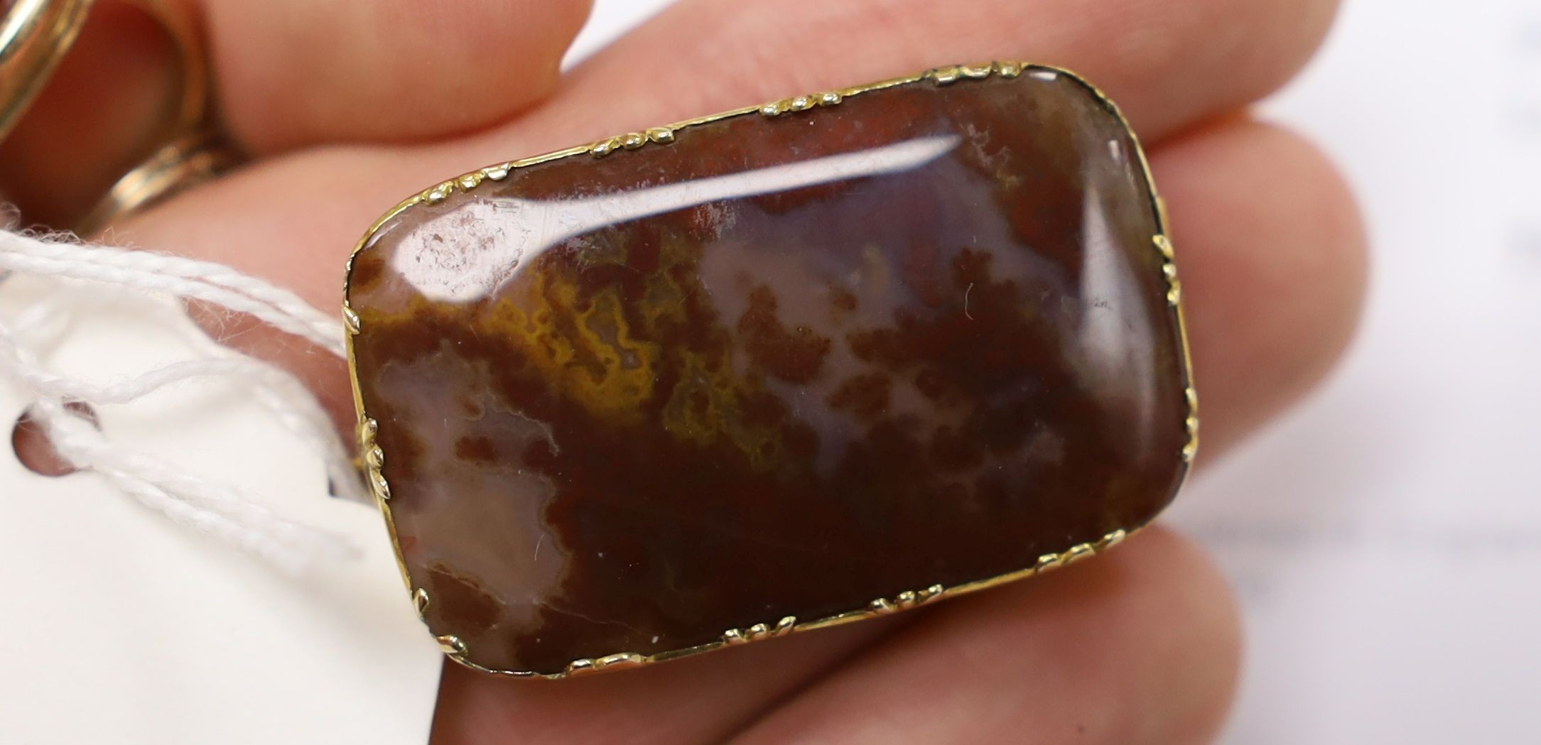 A Victorian yellow metal overlaid seal and and intaglio carnelian set seal, 21mm and a yellow metal and agate set brooch.